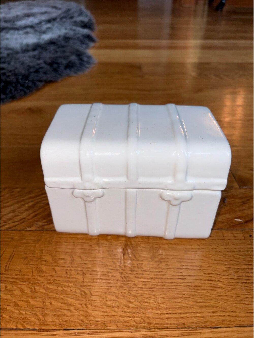 white ceramic miniature trunk trinket box features a molded travel-luggage strap
